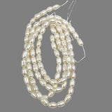 White Freshwater 8mm Oval Pearls Strand