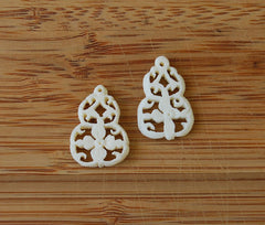 Pair of Pierced & Carved Bone Floral Pendants Vintage